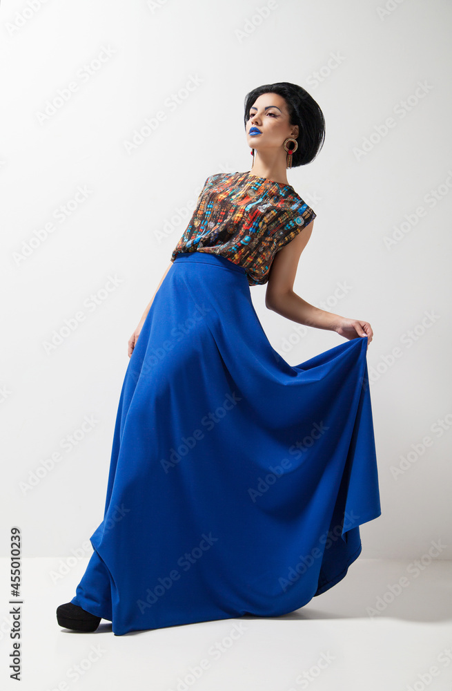 Naklejka premium Fashion photo of young woman in blue dress
