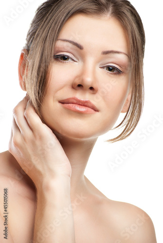 Beautiful woman's face with clean skin on white