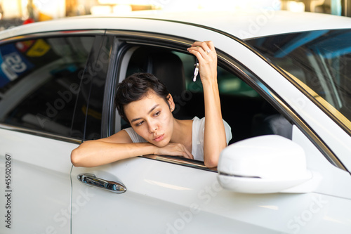 Beautiful young woman showing car key in hand. Newbie to drive concept. © NVB Stocker