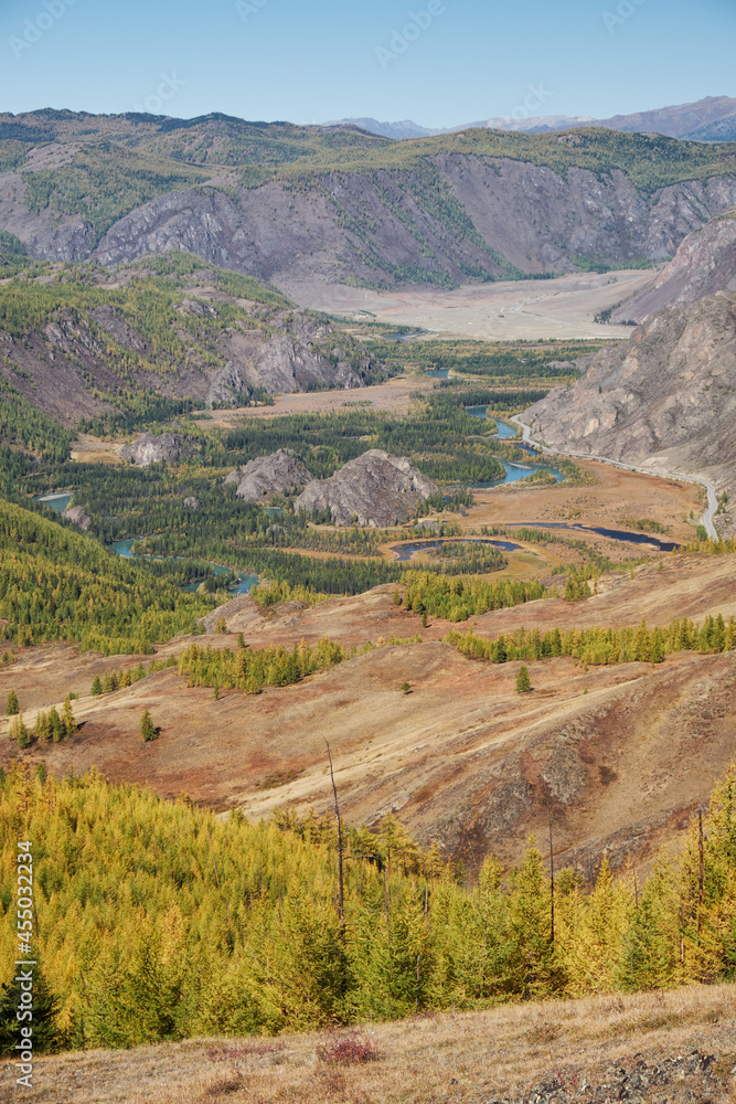 Autumn highland landscape. Altai river Chuya surrounded by mountains. Altai, Russia. Autumn highland landscape. Altai river Chuya surrounded by mountains. Altai, Russia.