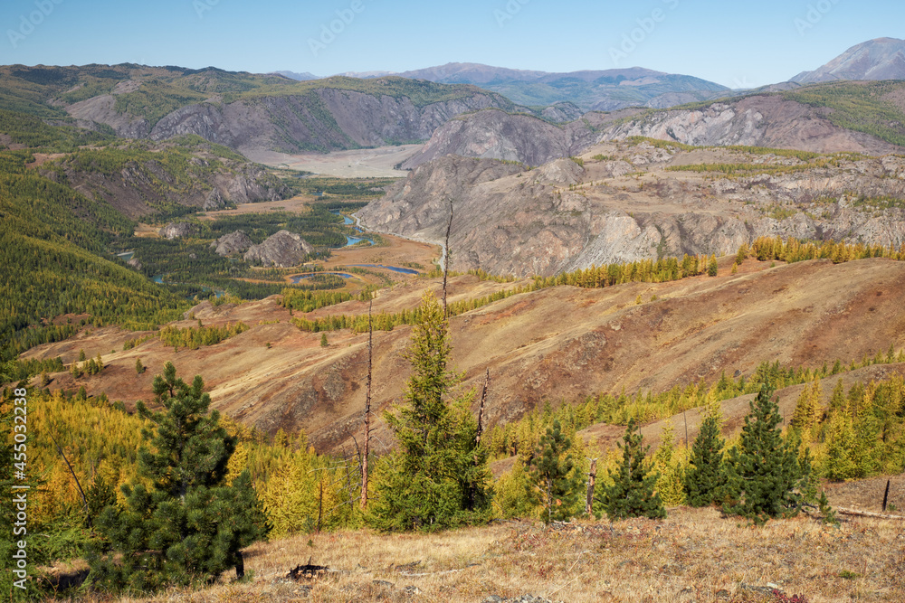 Autumn highland landscape. Altai river Chuya surrounded by mountains. Altai, Russia. Autumn highland landscape. Altai river Chuya surrounded by mountains. Altai, Russia.