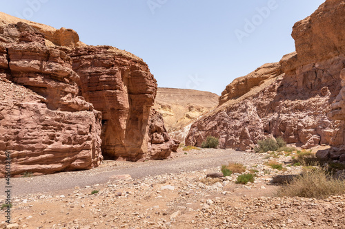 Narrow passage between rocks in a nature reserve near Eilat city - Red Canyon, in southern Israel