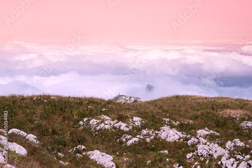 Typical Chartreuse landscape with the sun above the clouds