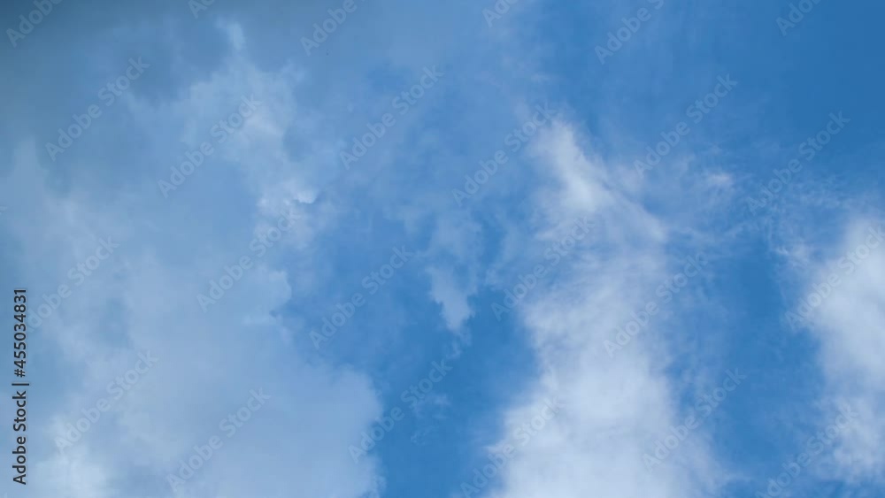 Light white clouds against the blue sky. Summer day weather. Light white clouds against the blue sky. Summer day weather.