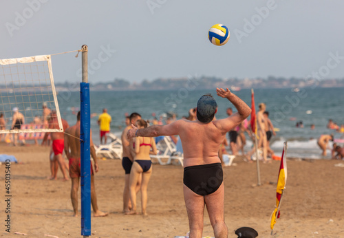 A man plays beach volleyball