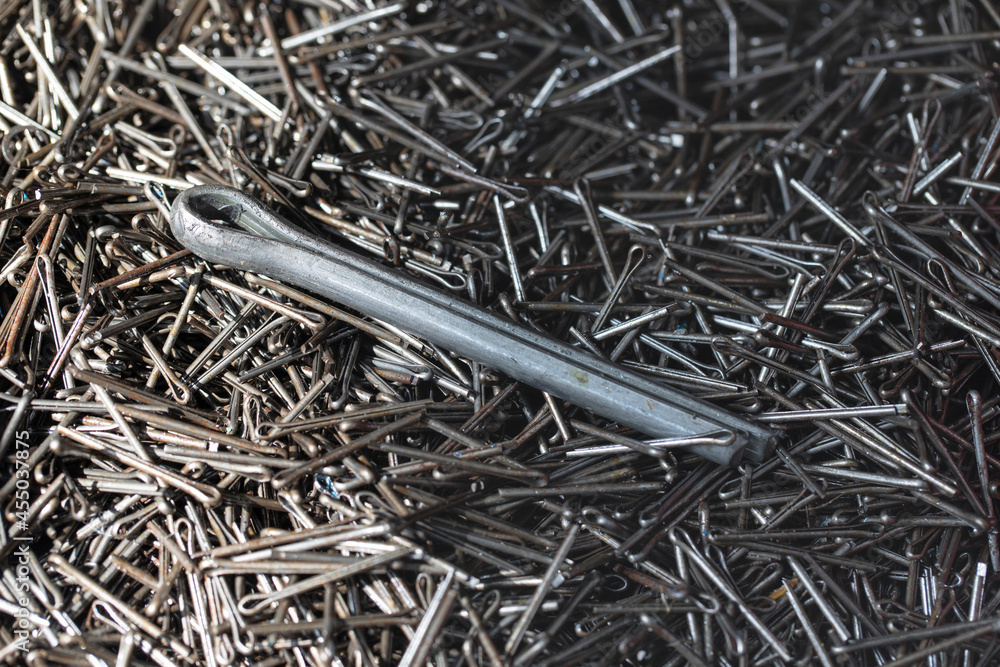 A pile of steel cotter pin for securing products. Cotter pin in the form of a wire for fastening