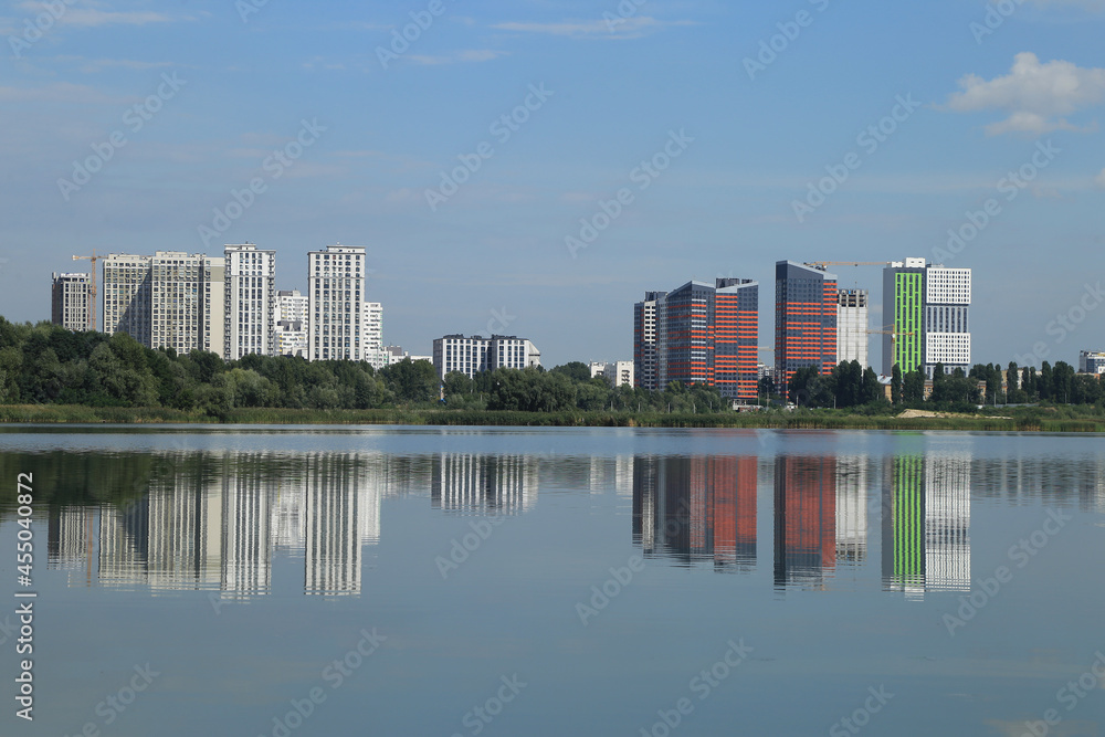 urban buildings on the shore of a large lake