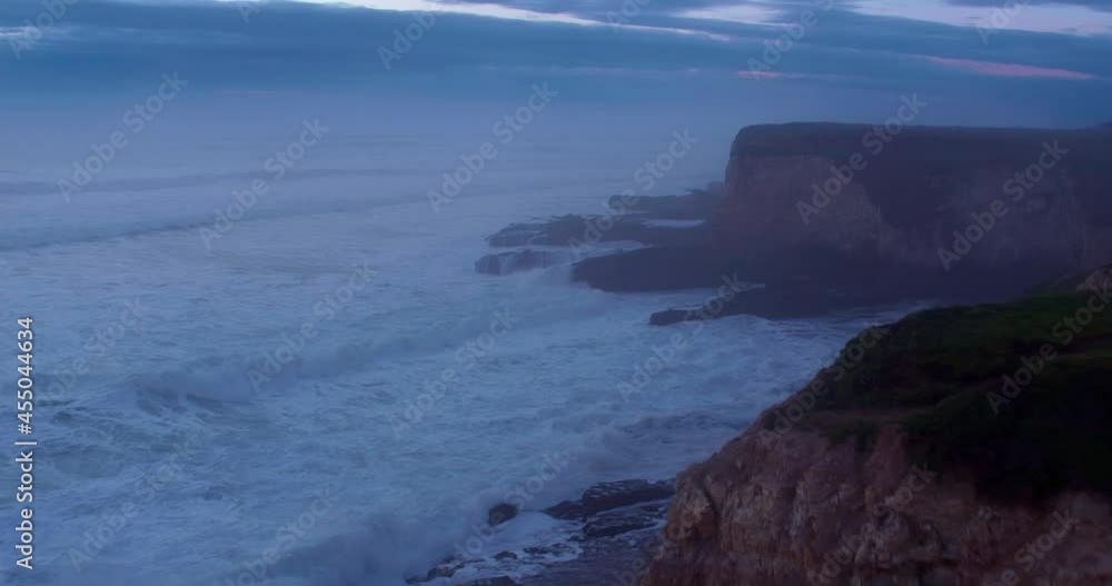 Aerial: Rocky coastline and beach at sunset. Panther Beach, Santa Cruz, USA Aerial: Rocky coastline and beach at sunset. Panther Beach, Santa Cruz, USA