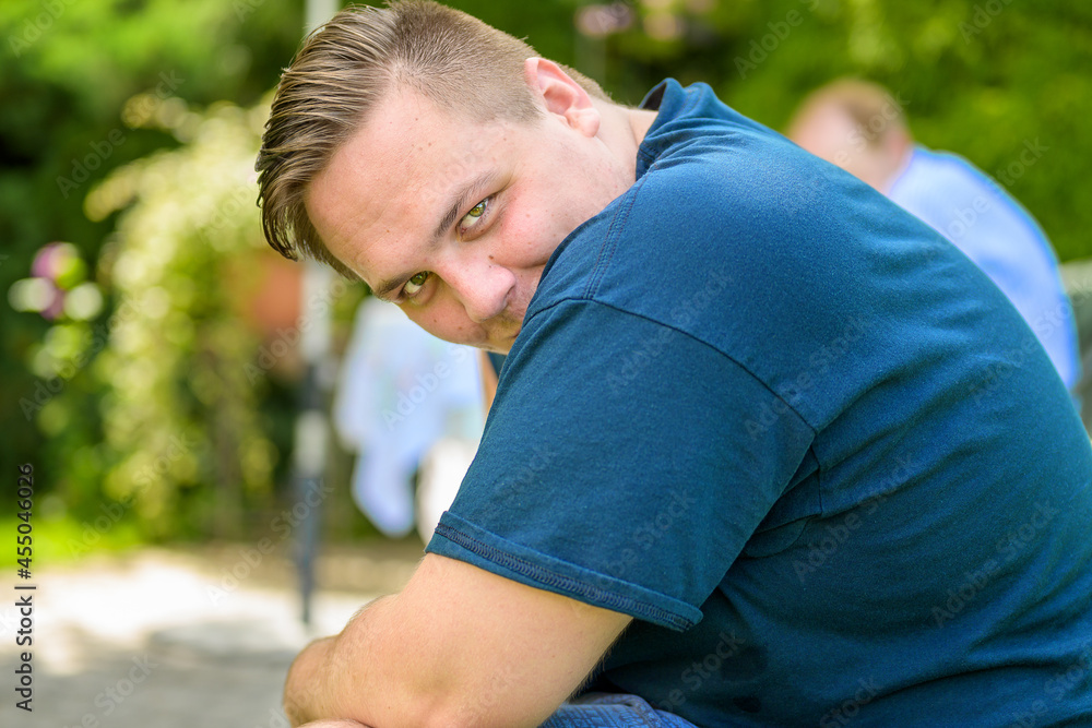 Friendly young man giving the camera a coy smile Friendly young man giving the camera a coy smile