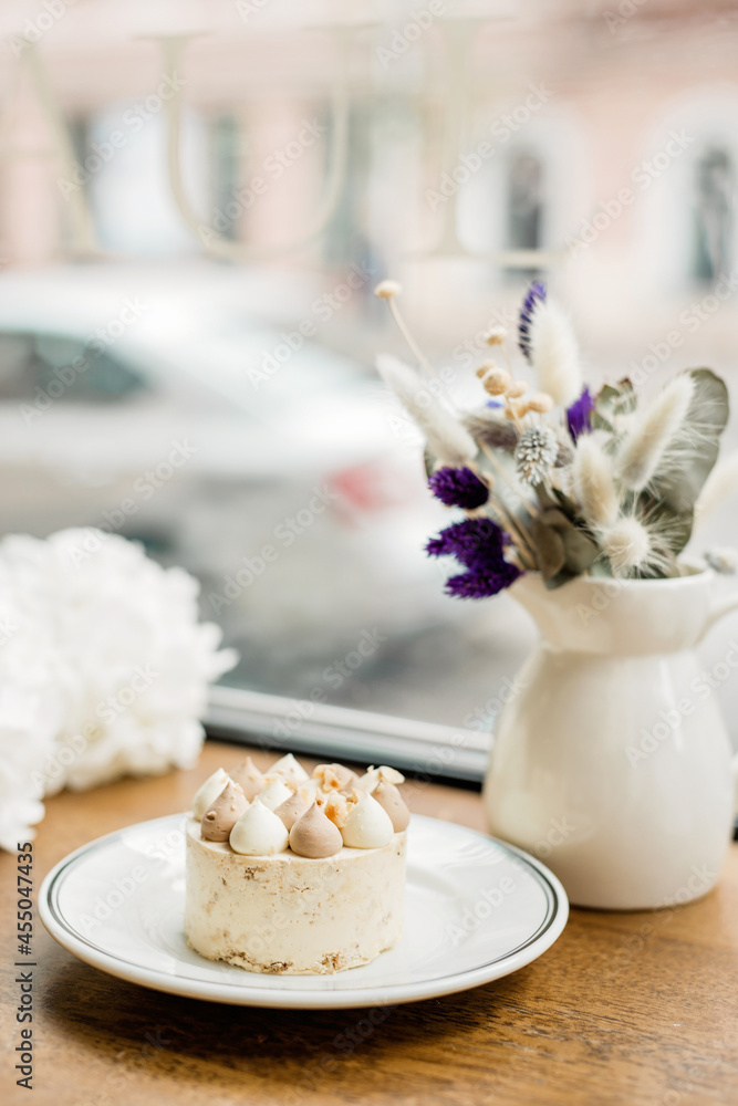 Beautiful delicious dessert on the table. Enjoy a freshly baked dessert in a coffee shop, restaurant. A closeup shot of a little sweet decorative cake. Soft selective focus. Beautiful delicious dessert on the table. Enjoy a freshly baked dessert in a coffee shop, restaurant. A closeup shot of a little sweet decorative cake. Soft selective focus.