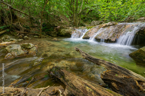 Fototapeta Naklejka Na Ścianę i Meble -  Runoff of the Ulu-Uzen river in the Khapkhal gorge of the natural park. Crimea, Russia, August 15, 2021