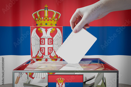 Cuadro en lienzo Serbia flag, hand dropping ballot card into a box - voting, election concept - 3