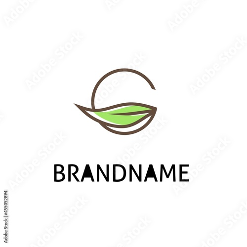 logo design letter G and green leaves,