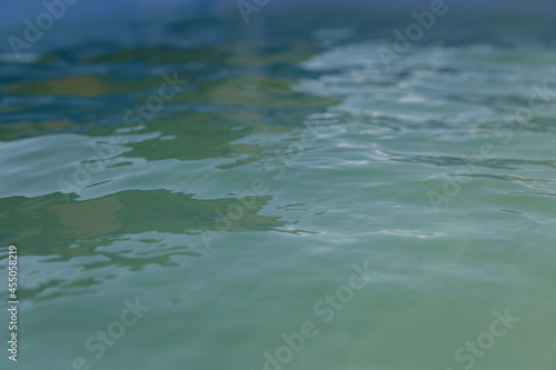 Brilliant blue water in a pool or pond. Blue water