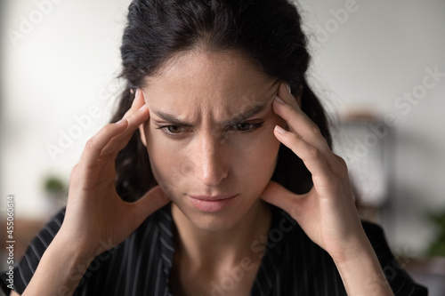 Cuadro en lienzo Stressed focused woman thinking hard, trying to remember important event, feeling depressed, anxious, going through emotional crisis, touching face, looking into vacancy