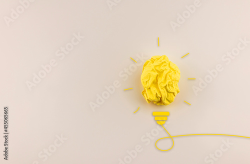 Creativity, inspiration and innovation paper crumpled light bulb on blank background with copy space.