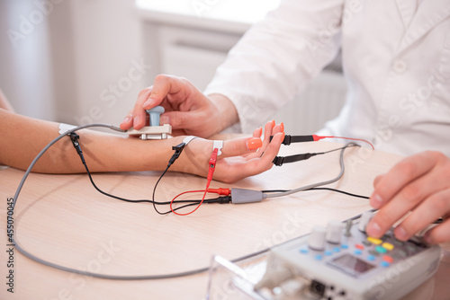 Patient nerves testing using electromyography at medical center photo