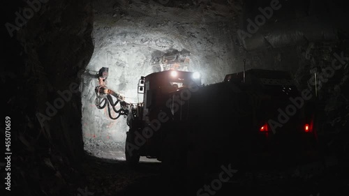 A drilling machine works in an underground mine.