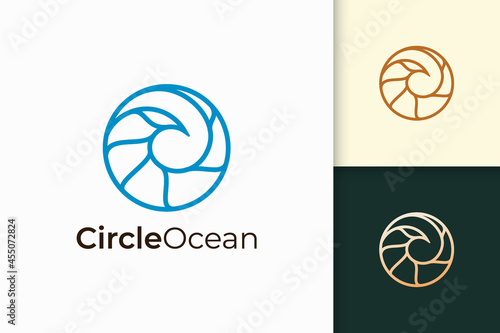 Sea or ocean logo in simple circle shape represent beach or surfing