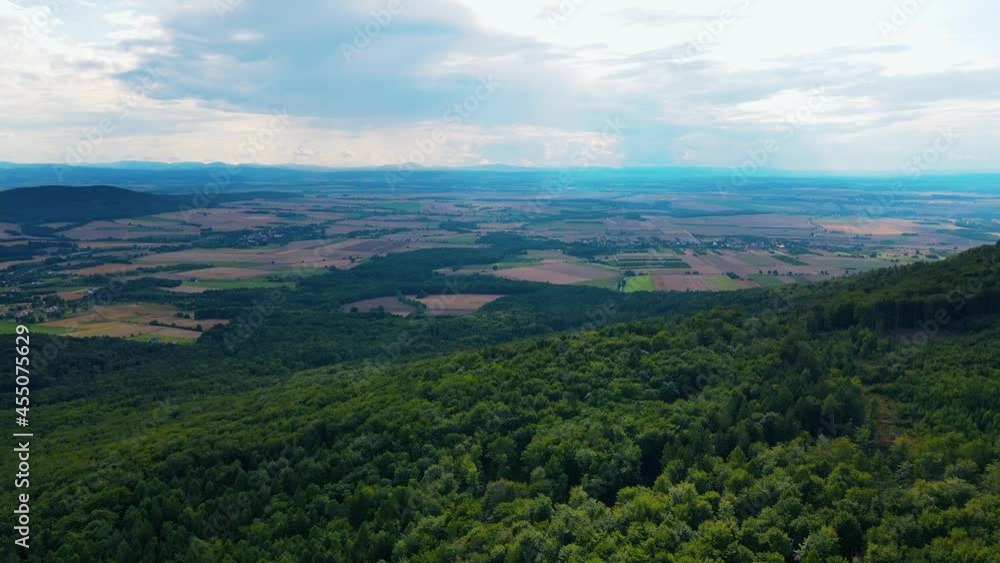 Drone flight over mountain village with forests. Sleza mountain near Wroclaw in Poland. Nature background, aerial view Drone flight over mountain village with forests. Sleza mountain near Wroclaw in Poland. Nature background, aerial view