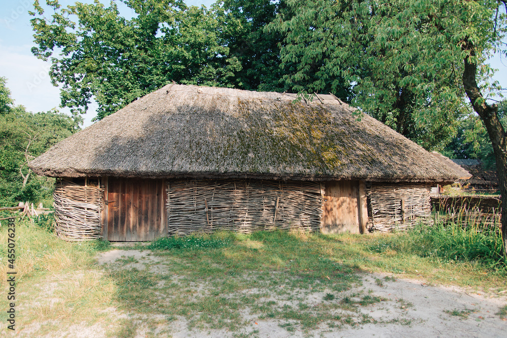 old rural house with thatched roof