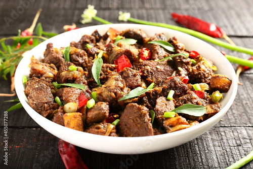 Homemade meat fry with spices, traditional Indian recipes.