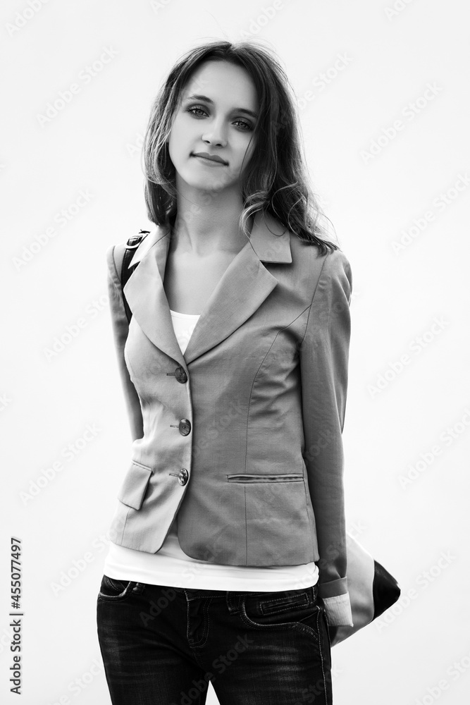 Happy young fashion woman in gray blazer with handbag Happy young fashion woman in gray blazer with handbag