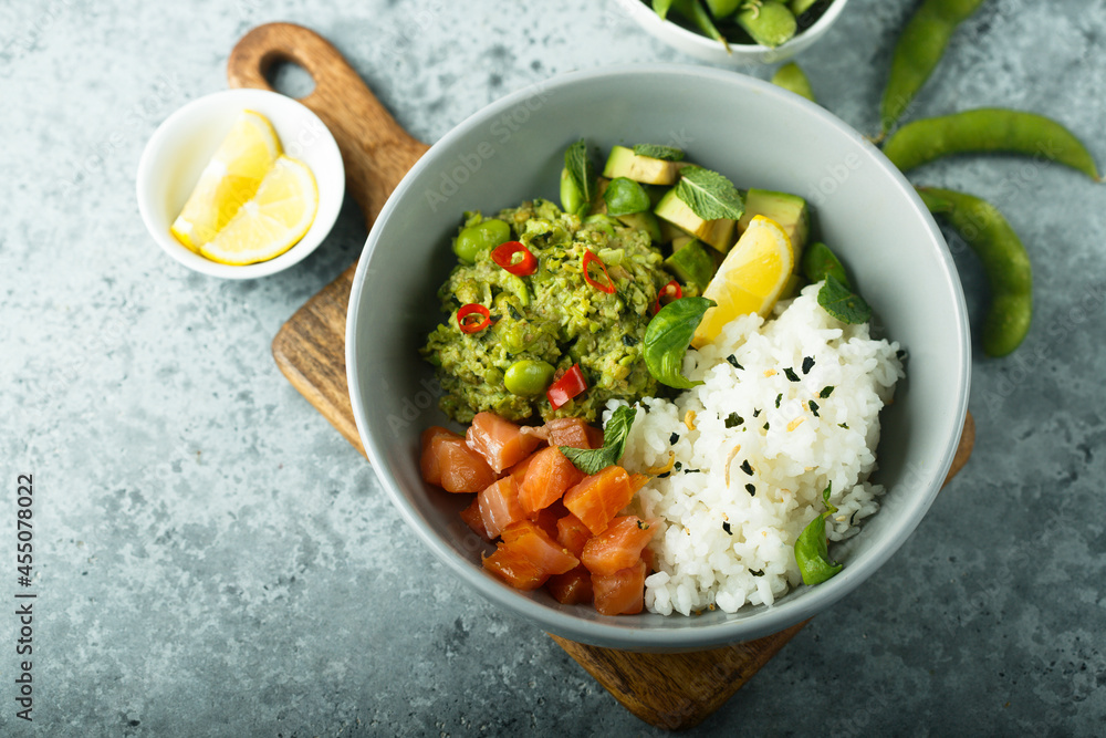 Healthy rice bowl with salmon and mashed avocado Healthy rice bowl with salmon and mashed avocado