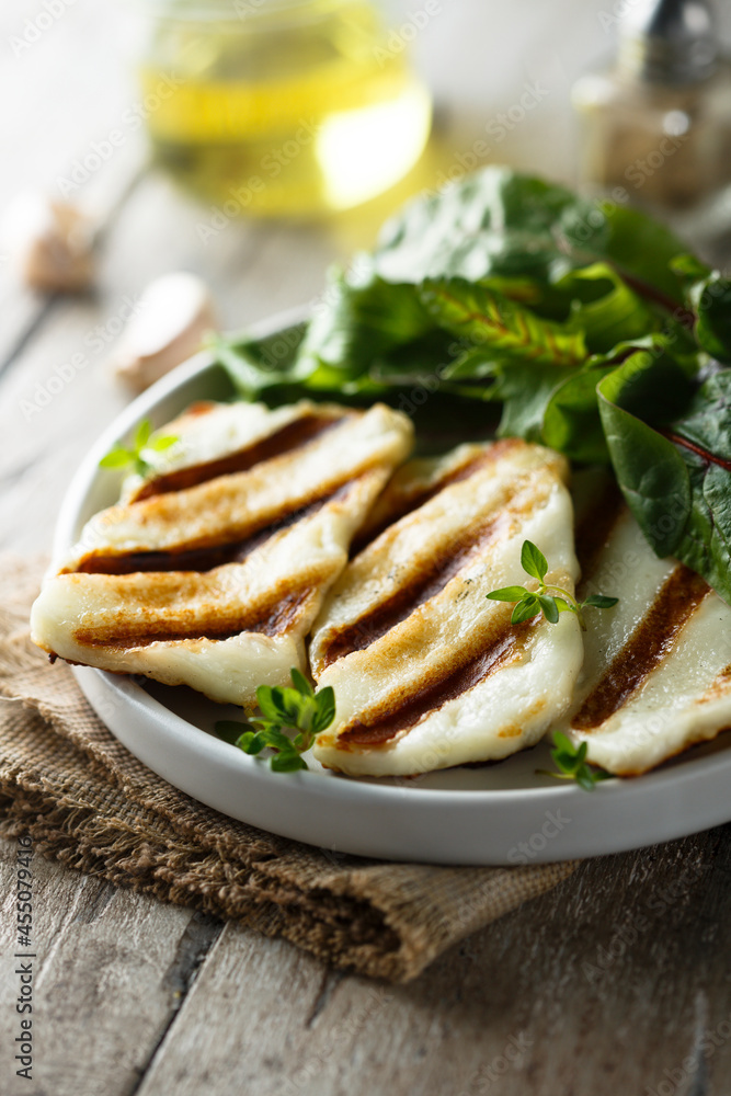 Grilled halloumi cheese with fresh green salad Grilled halloumi cheese with fresh green salad