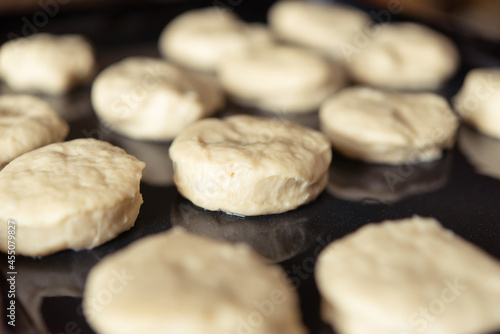 Process of raising the dough in a special basket. Dough made from natural sourdough. Wheat dough. Fermentation. Top view.	 photo