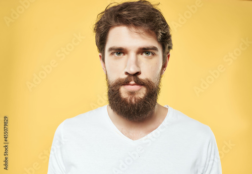 emotional man in a white t-shirt expressive look discontent close-up