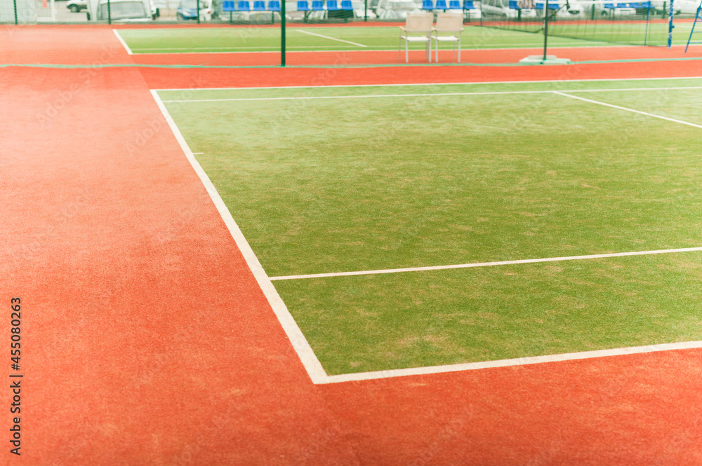 An empty tennis court ready to compete. Tennis court with artificial turf.