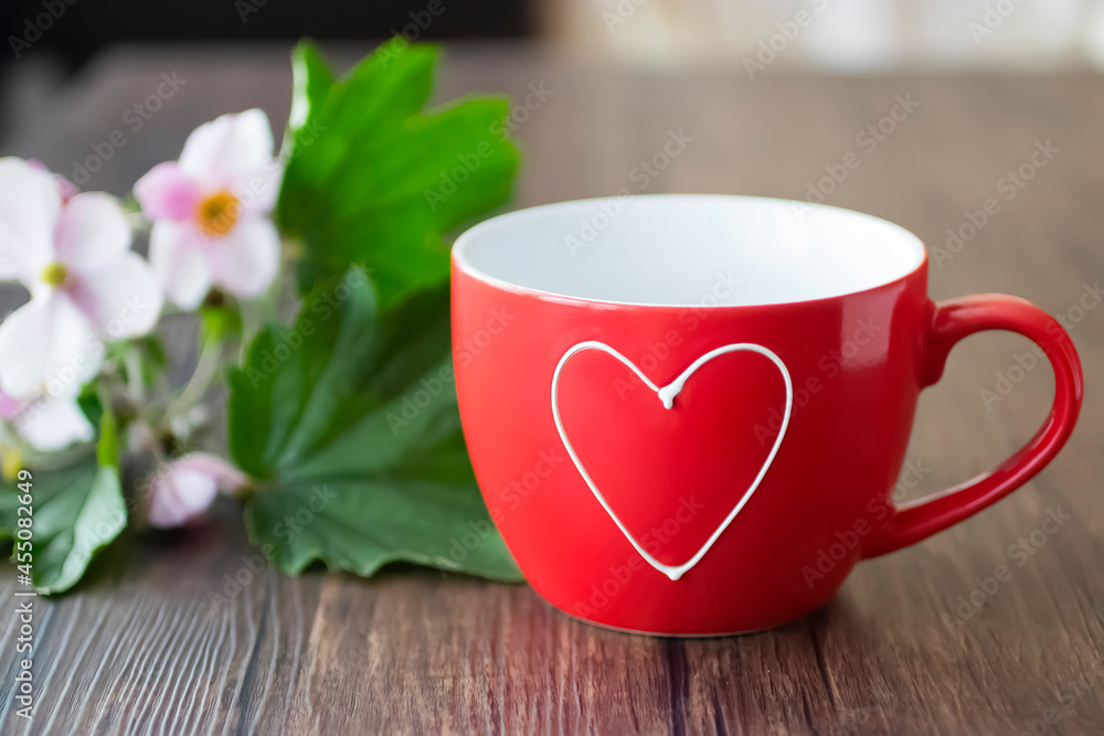 Red cup on brown wooden table. Red cup on brown wooden table.