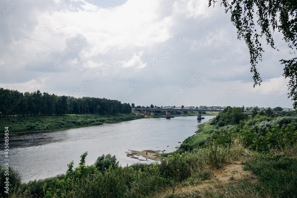 Picturesque view of the river. Bridge over the river. Beautiful river bank. Western Dvina. Polotsk, Belarus