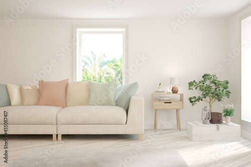 White living room with sofa and summer landscape in window. Scandinavian interior design. 3D illustration