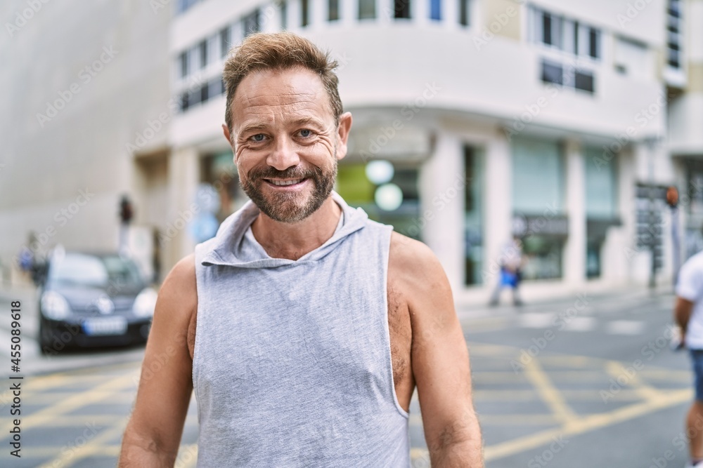 Middle age man smiling confident at the city Middle age man smiling confident at the city