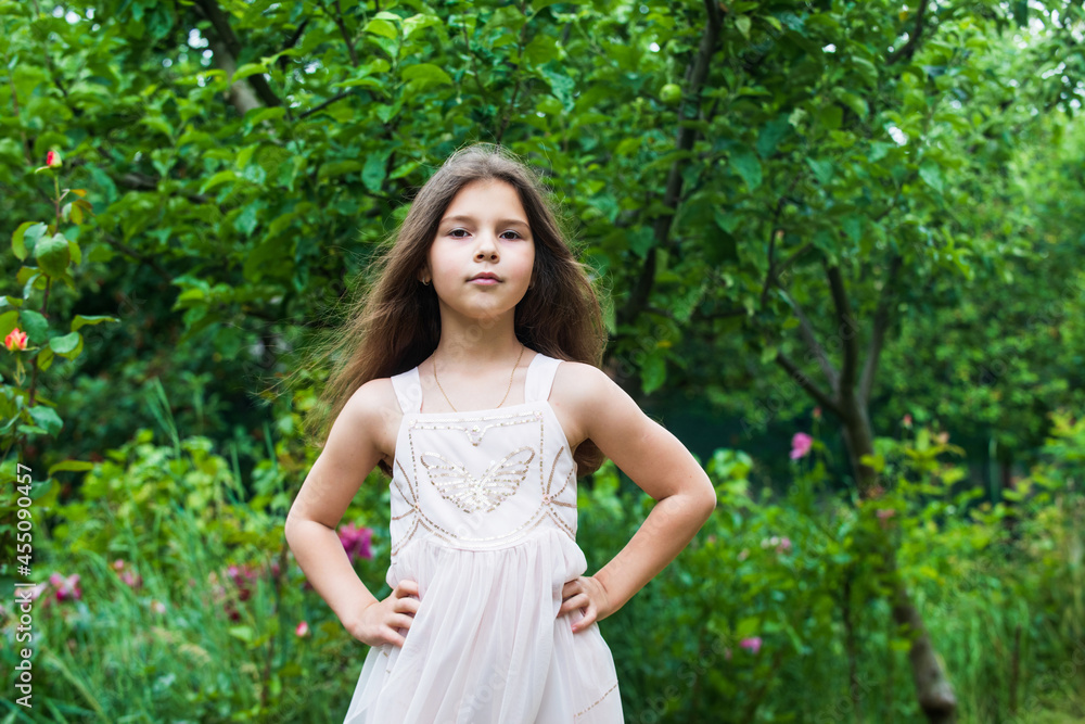 Small girl walking summer park nature background, kindergarten camp concept Small girl walking summer park nature background, kindergarten camp concept