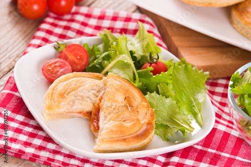 Puff pastry filled with tomato and mozzarella cheese.