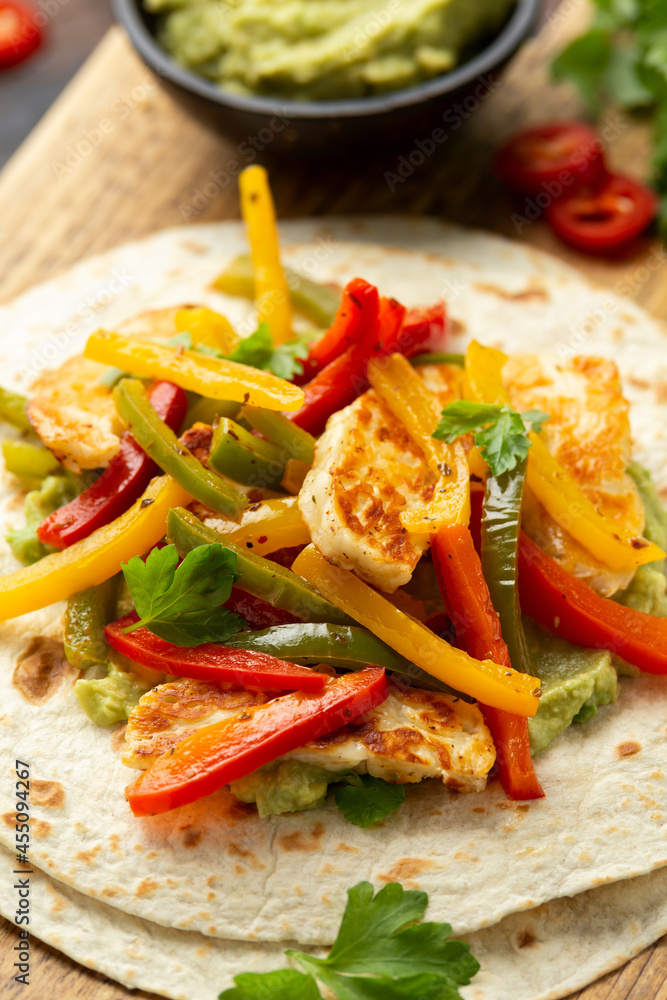 Tasty Halloumi cheese Fajitas with tortilla mix pepper and guacamole. Healthy food Tasty Halloumi cheese Fajitas with tortilla mix pepper and guacamole. Healthy food
