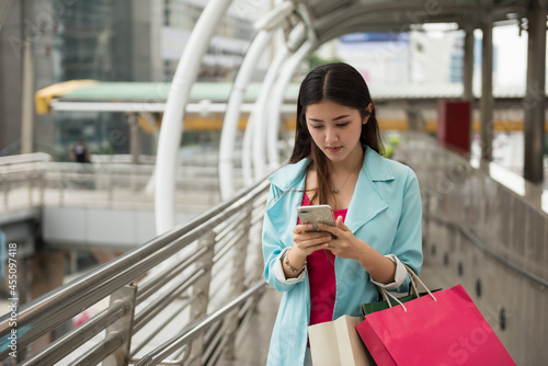 Tourist woman check shopping location on phone