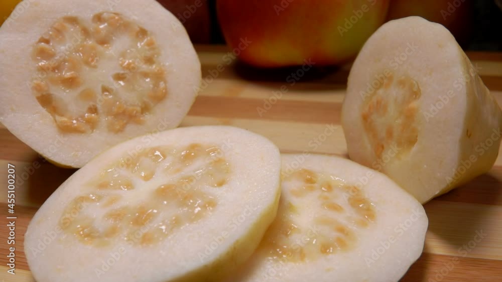 Panorama of the exotic Guava fruit slices lying on a bamboo board Panorama of the exotic Guava fruit slices lying on a bamboo board
