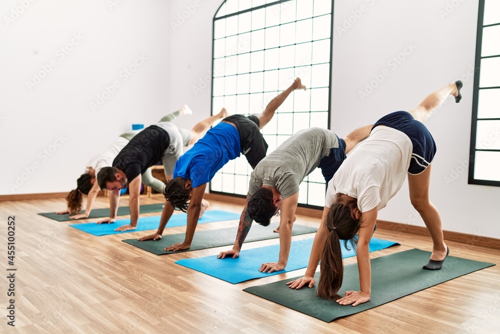 Group of young sporty people concentrate training yoga at sport center. Group of young sporty people concentrate training yoga at sport center.