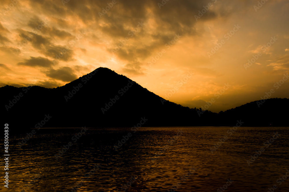 Silhouette of nature with mountains, rivers and sky.
