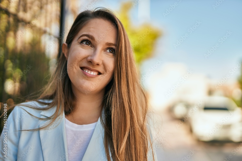 Young blonde businesswoman smiling happy standing at the city. Young blonde businesswoman smiling happy standing at the city.