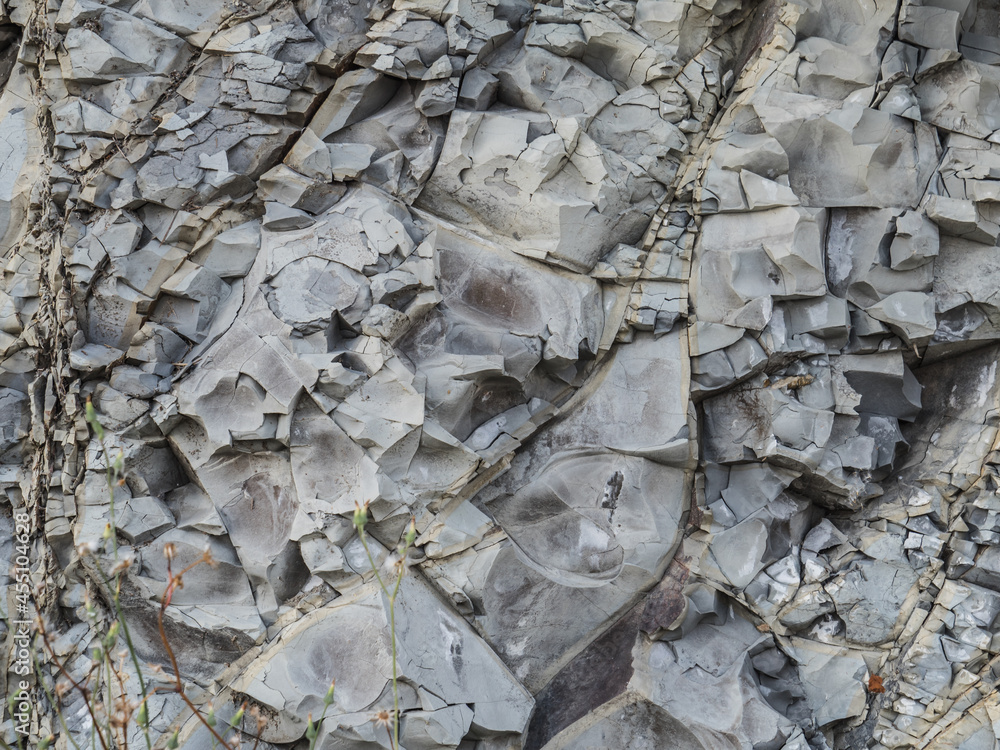 Old texture of mountain stones close up. Stone gray volumetric background. Geology. Pattern. Horizontally Old texture of mountain stones close up. Stone gray volumetric background. Geology. Pattern. Horizontally