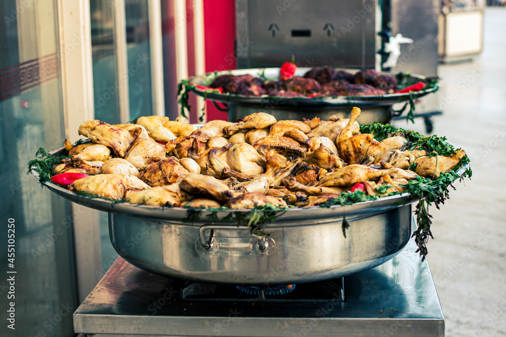 Large frying pan with fried chicken during frying. Large frying pan with fried chicken during frying.
