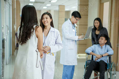group of asian Doctor And Patient Meeting  In Hospital lobby Area