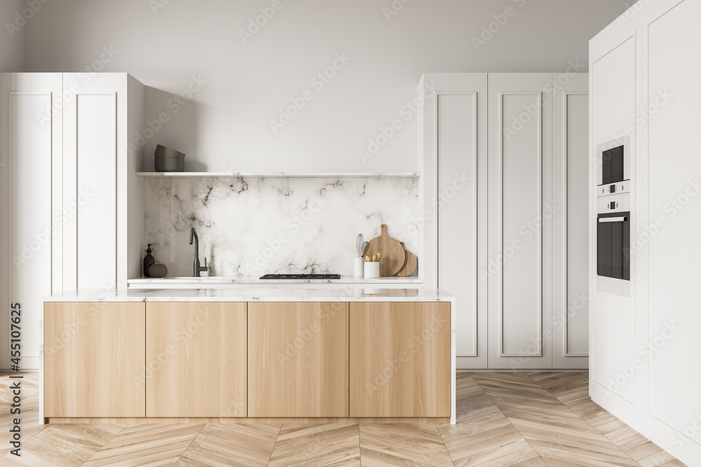 White kitchen with marble backsplash and wood materials Stock ...