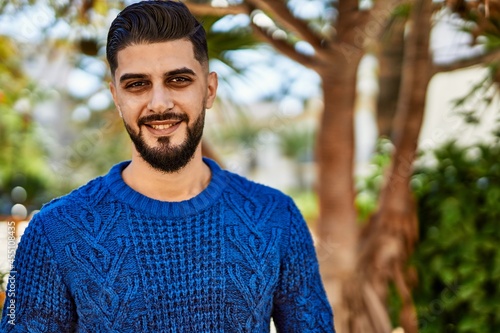 Young arab man smiling confident at park