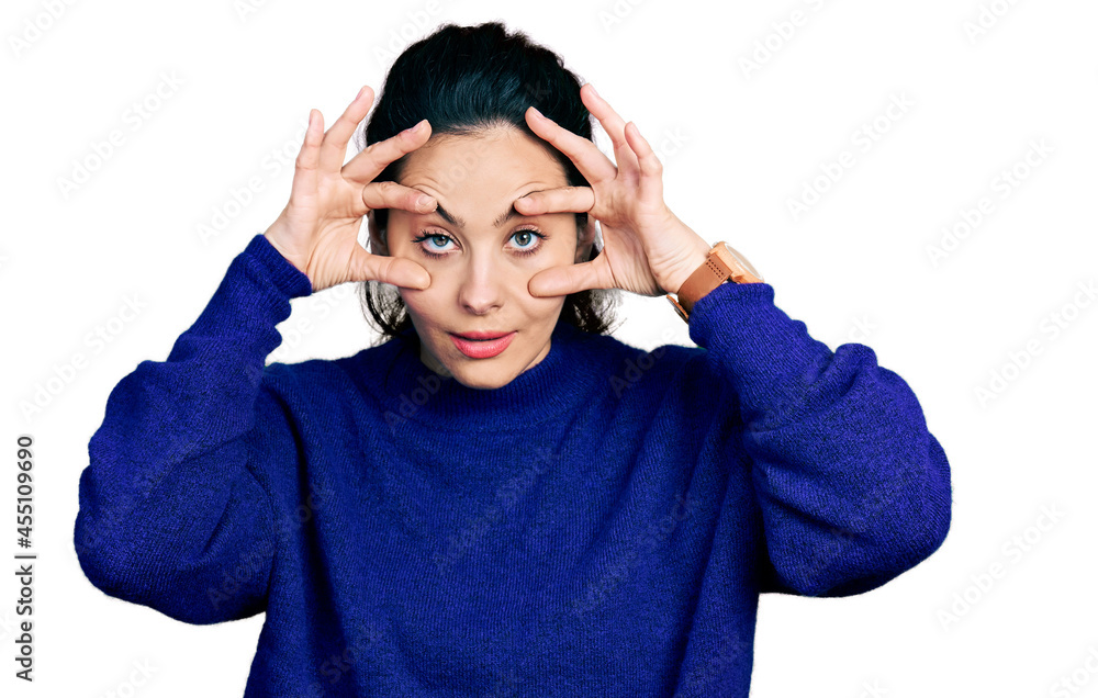 Naklejka premium Young hispanic woman wearing casual clothes trying to open eyes with fingers, sleepy and tired for morning fatigue